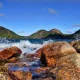 Acadia National Park Jordon Pond rocks with water splashing.