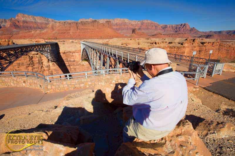Lee Ferry, AZ, photography client taking pictures at the Navajo Bridge in Glen Canyon National Recreation Area