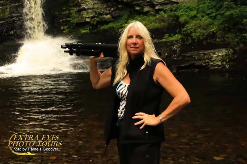 Pamela Goodyer Pamela Goodyer with her triopod in front of a waterfall on the photo tour learning photography